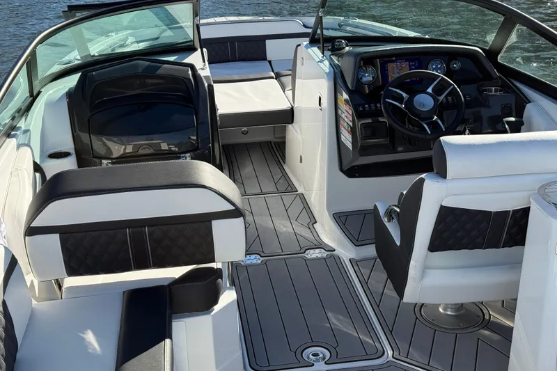 Slide: The Image of 2025 Monterey M4 boat interior with modern dashboard and luxurious seating. - 23