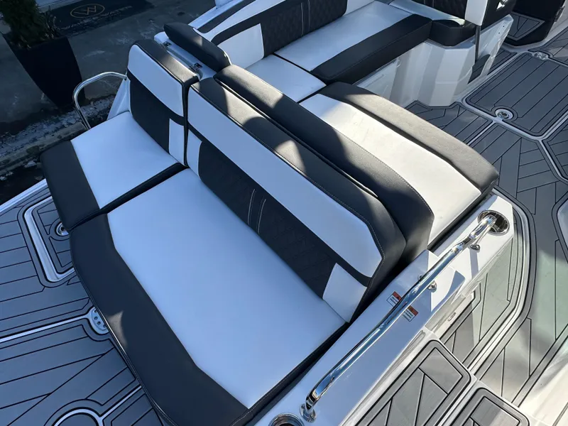 Slide: The Image of 2025 Monterey M4 boat cruising on a scenic lake with wooded shoreline. - 3