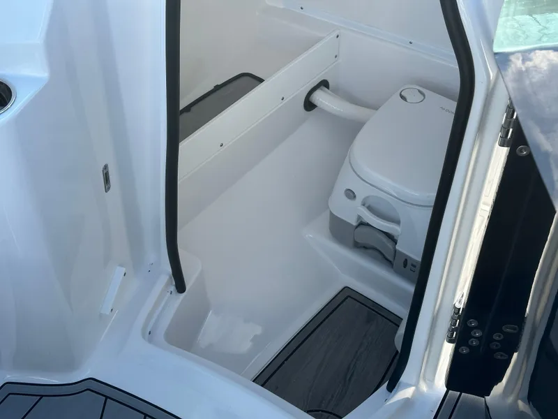 Slide: The Image of 2025 Monterey M4 boat cruising on a scenic lake with wooded shoreline. - 4