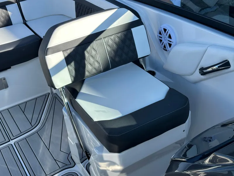 Slide: The Image of 2025 Monterey M4 boat cruising on a scenic lake with forested shoreline. - 7