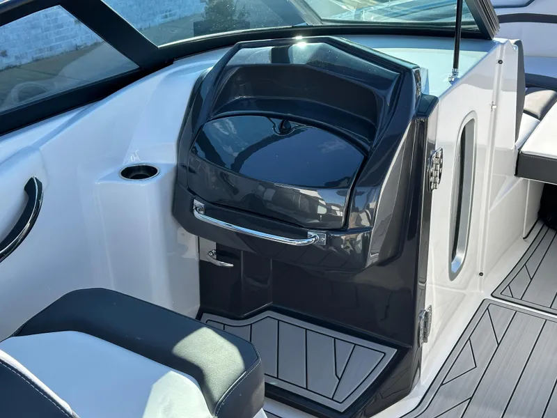 Slide: The Image of 2025 Monterey M4 boat interior with cushioned seating, sleek design, and open water view. - 9