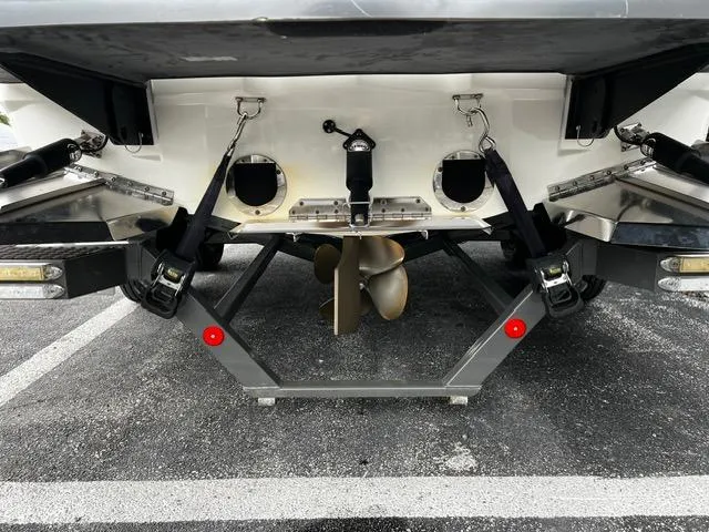 Slide: The Image of Rear view of a 2018 MasterCraft XT20 boat showing propeller and attachments. - 10