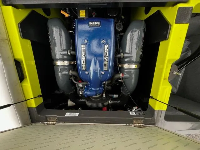 Slide: The Image of 2018 MasterCraft XT20 engine compartment with Ilmor engine, highlighted in yellow and black. - 13