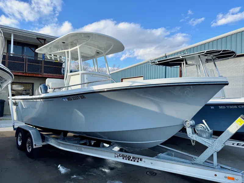 Slide: The Image of 2020 Parker 2300 Special Edition boat on trailer, parked outdoors under blue sky. - 0