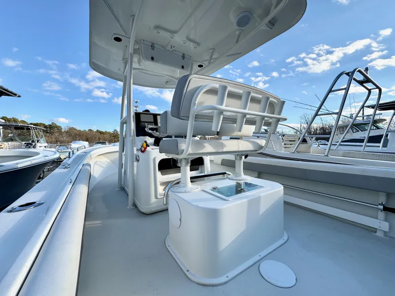 Slide: The Image of 2020 Parker 2300 Special Edition boat interior with seating and clear sky. - 10