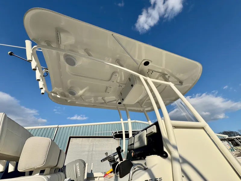 Slide: The Image of 2020 Parker 2300 Special Edition boat with T-top under a clear blue sky. - 15