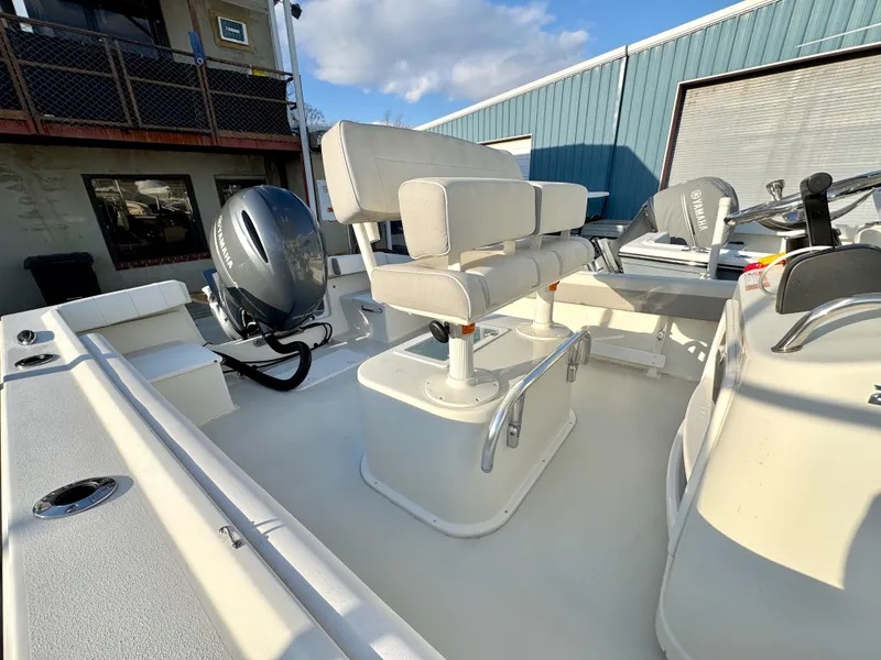 Slide: The Image of 2020 Parker 2300 Special Edition boat interior with seating and motor. - 8