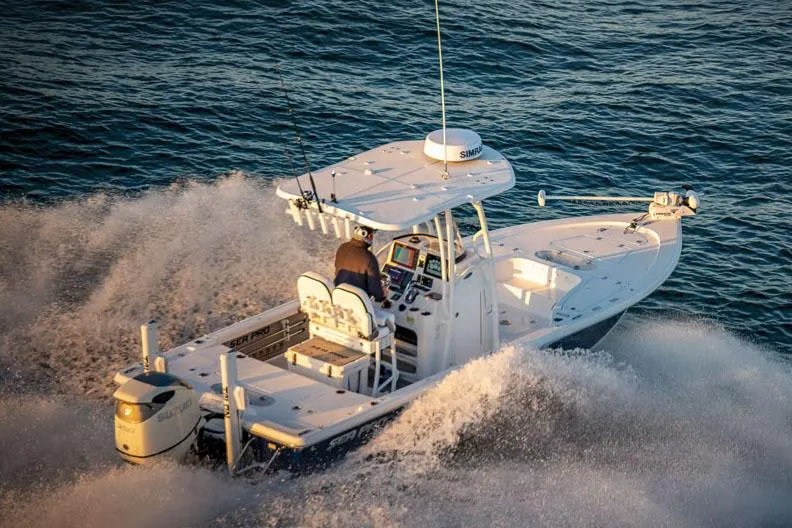 Slide: The Image of 2025 Sea Pro 250 Bay boat with Mercury outboard motor, light blue hull. - 23