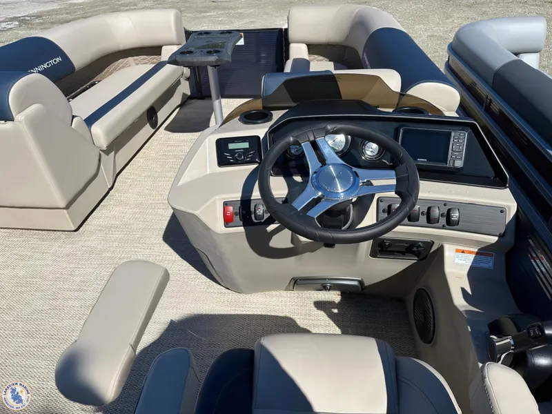 Slide: The Image of 2024 Bennington 22 SSR boat interior with steering console and seating arrangement. - 3