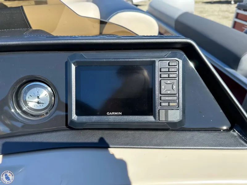 Slide: The Image of Garmin display and fuel gauge on 2024 Bennington 22 SSR boat dashboard. - 6