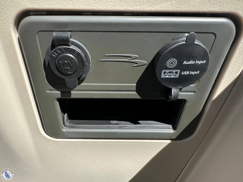 Slide: The Image of 2024 Bennington 22 SSR dashboard with 12V and USB audio input ports. - 8