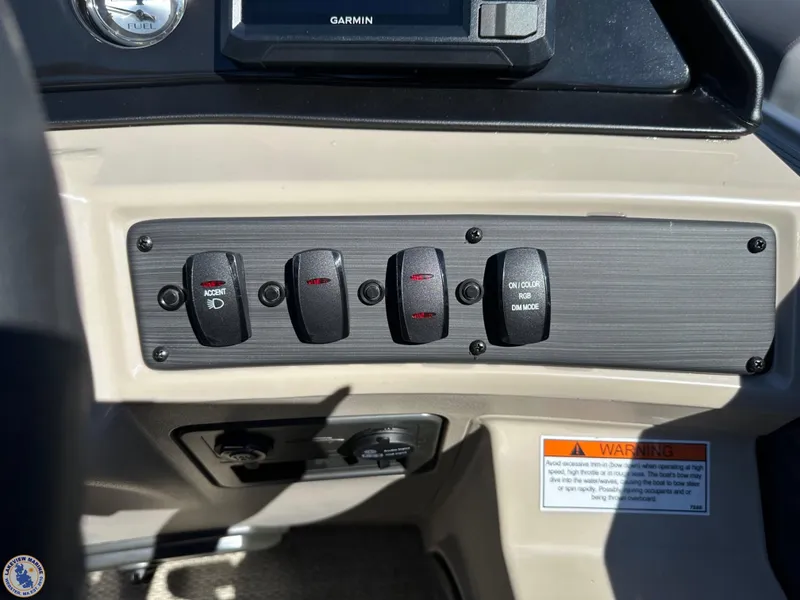 Slide: The Image of Control panel of 2024 Bennington 22 SSR boat with switches and Garmin display. - 9