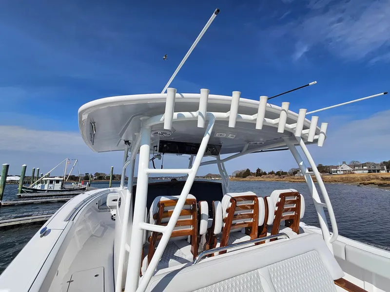 Slide: The Image of 2025 Southport 38 FE boat on calm water, featuring sleek design and advanced technology. - 12