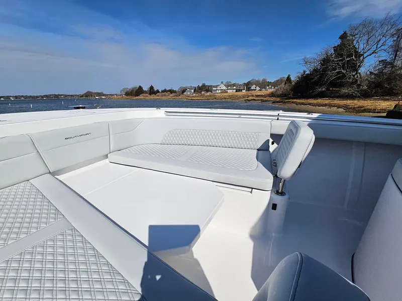 Slide: The Image of Aerial view of 2025 Southport 38 FE boat on water, showcasing sleek design and triple engines. - 26