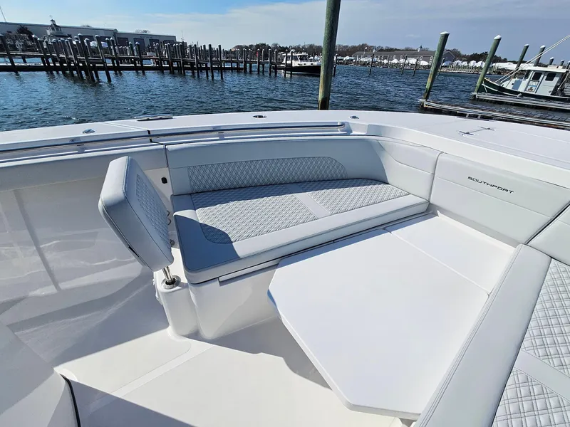 Slide: The Image of 2025 Southport 38 FE boat deck with wood finish and Mercury engine. - 27