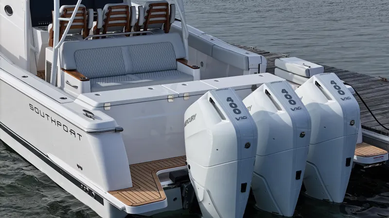 Slide: The Image of 2025 Southport 38 FE boat interior with luxurious seating and wooden accents. - 43