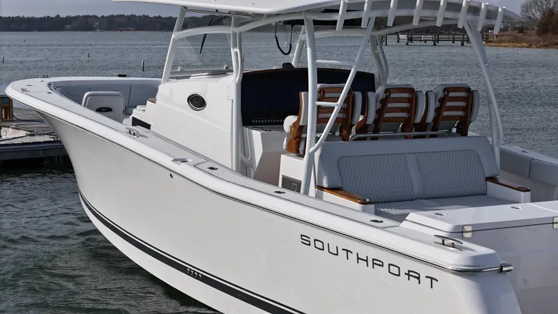 Slide: The Image of 2025 Southport 38 FE boat dashboard with advanced navigation system on open water. - 46
