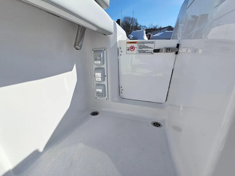 Slide: The Image of 2025 Southport 38 FE boat on calm water, surrounded by lush greenery. - 5