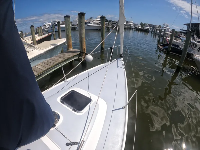 Slide: The Image of 2022 J Boats J/9 sailboat docked at a marina under clear skies. - 14
