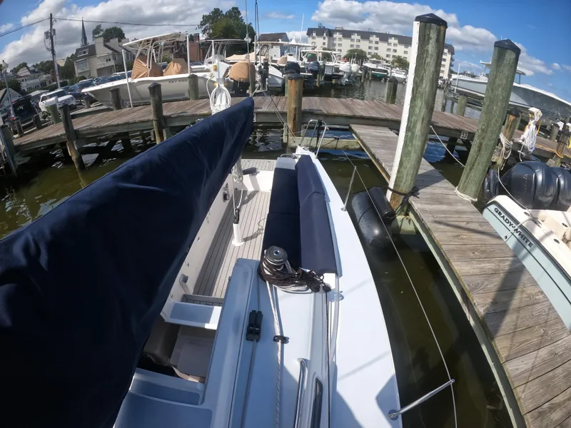 Slide: The Image of 2022 J Boats J/9 docked at a marina with clear skies. - 17
