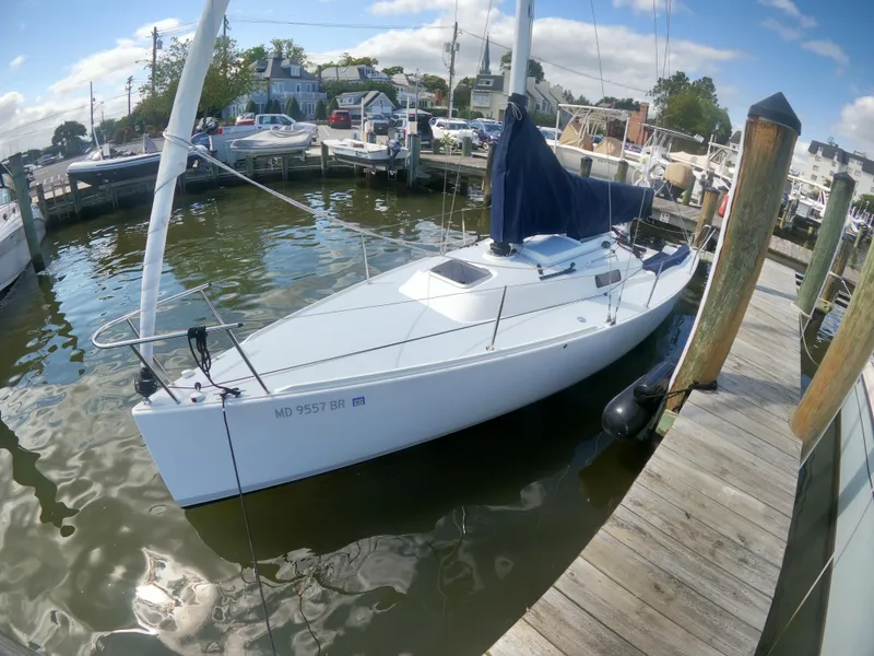 Slide: The Image of 2022 J Boats J/9 sailboat docked at a marina, sunny day. - 2
