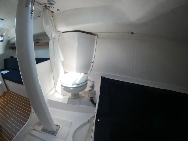 Slide: The Image of 2022 J Boats J/9 interior cabin with toilet and seating area. - 24