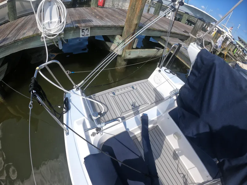 Slide: The Image of 2022 J Boats J/9 sailboat docked, showcasing deck and rigging details. - 6