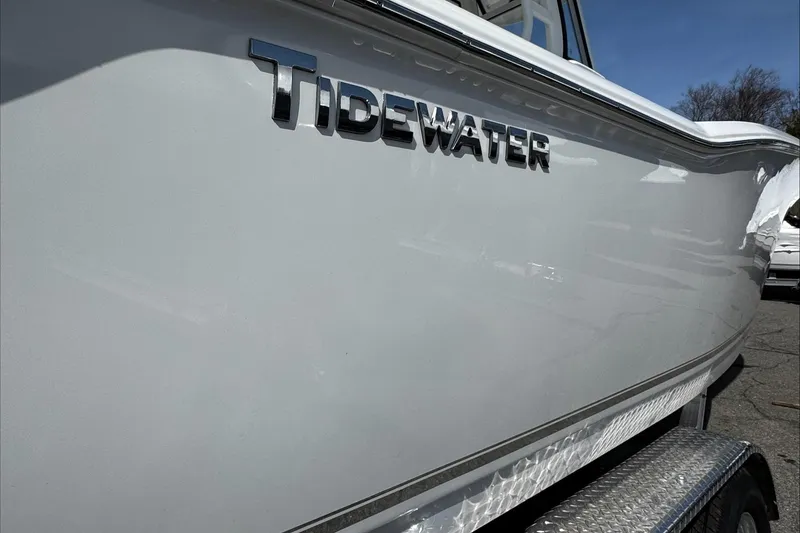 Slide: The Image of 2025 Tidewater 232 CC Adventure boat side view with logo. - 11
