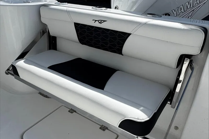Slide: The Image of 2025 Tidewater 232 CC Adventure boat seat with black and white upholstery. - 14