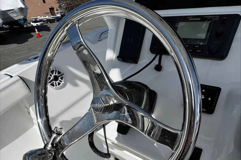 Slide: The Image of Steering wheel of 2025 Tidewater 232 CC Adventure boat with Garmin navigation system. - 18