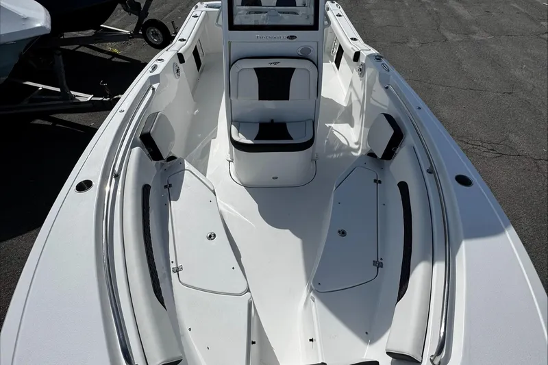 Slide: The Image of 2025 Tidewater 232 CC Adventure boat, featuring spacious seating and sleek design. - 28