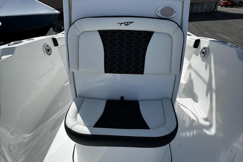 Slide: The Image of 2025 Tidewater 232 CC Adventure boat seat with black and white upholstery. - 29