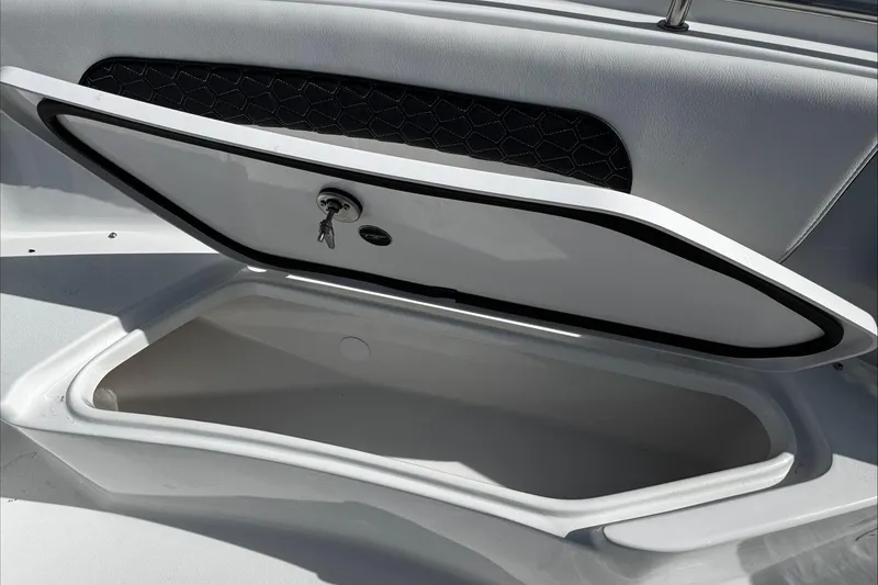 Slide: The Image of Open storage compartment on 2025 Tidewater 232 CC Adventure boat. - 31