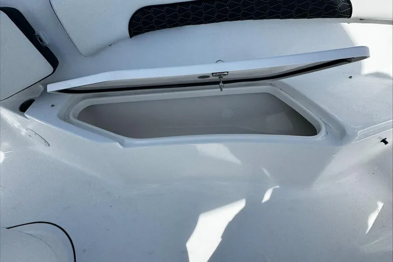 Slide: The Image of Open storage compartment on 2025 Tidewater 232 CC Adventure boat. - 32