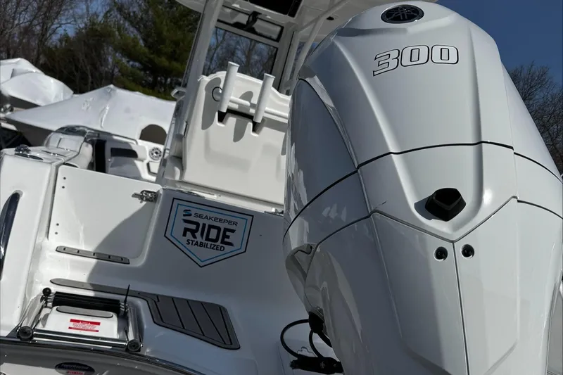 Slide: The Image of 2025 Tidewater 232 CC Adventure boat with powerful 300 engine, featuring Seakeeper Ride stabilization. - 6