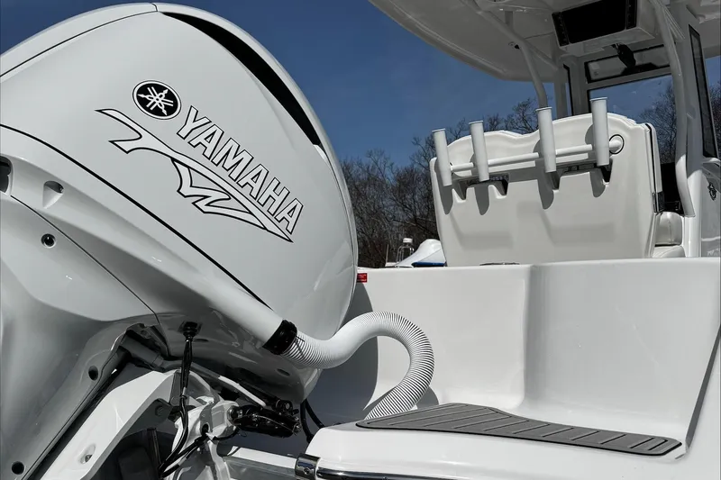 Slide: The Image of 2025 Tidewater 232 CC Adventure boat with Yamaha engine, featuring sleek design and modern amenities. - 7