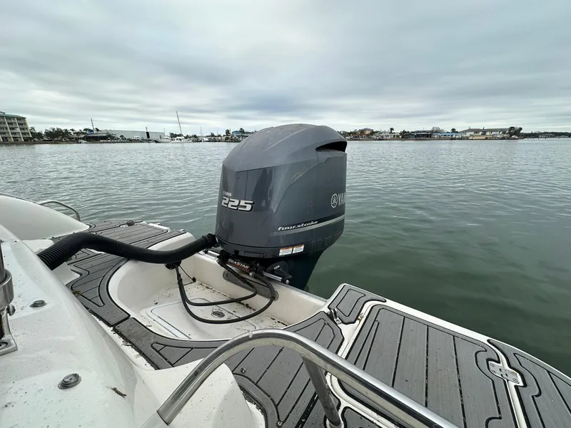 Slide: The Image of 2007 Hurricane SunDeck 237 OB with Yamaha 225 outboard motor on calm water. - 11