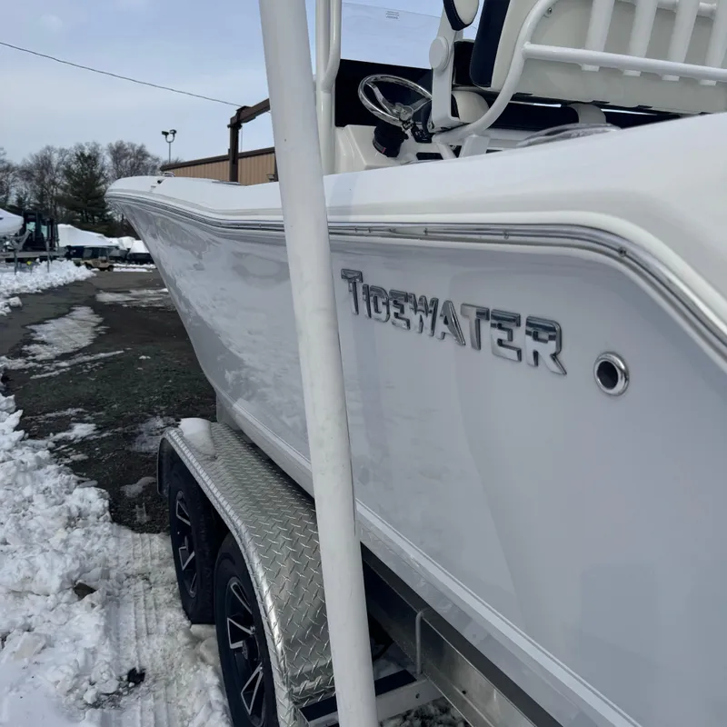 Slide: The Image of 2025 Tidewater 198 CC Adventure boat on trailer in snowy setting. - 11
