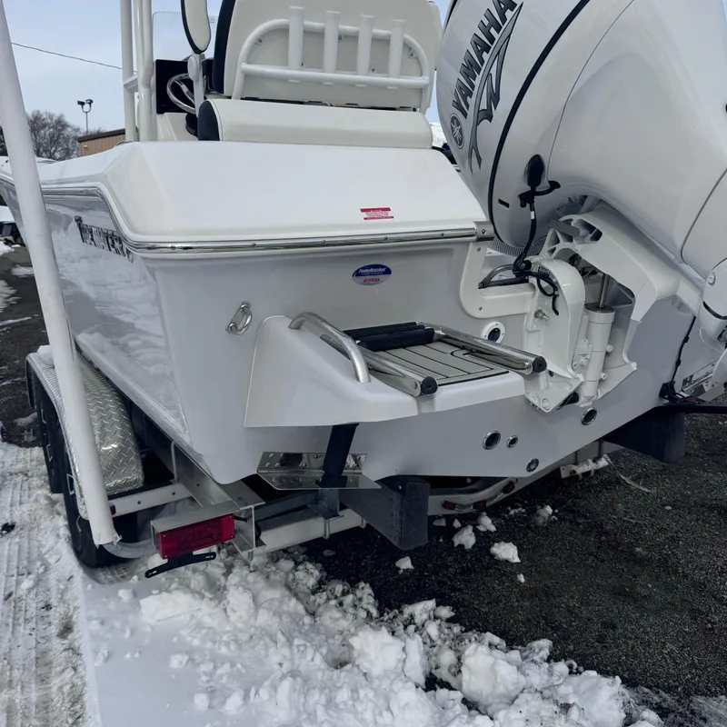 Slide: The Image of 2025 Tidewater 198 CC Adventure boat with Yamaha engine, parked on snowy ground. - 14