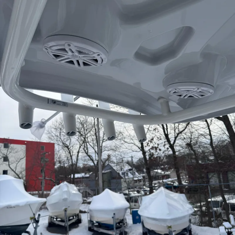 Slide: The Image of 2025 Tidewater 198 CC Adventure boat speakers and rod holders, winter storage setting. - 15