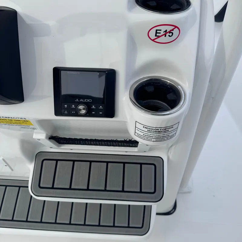 Slide: The Image of 2025 Tidewater 198 CC Adventure boat console with JL Audio system and cup holders. - 19