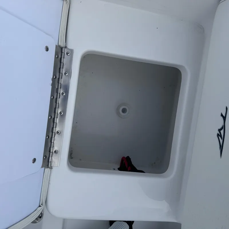 Slide: The Image of Open storage compartment on a 2025 Tidewater 198 CC Adventure boat. - 20