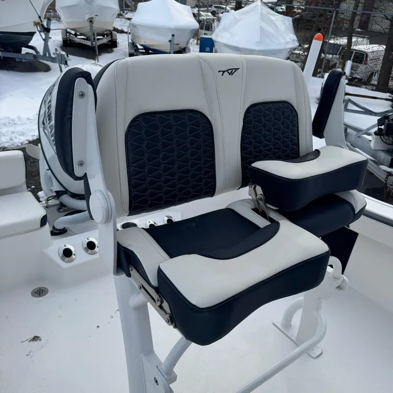 Slide: The Image of 2025 Tidewater 198 CC Adventure boat seat with cushioned armrests and sleek design. - 23