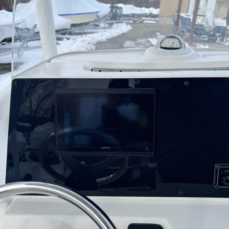 Slide: The Image of Dashboard of 2025 Tidewater 198 CC Adventure boat with Garmin display. - 34