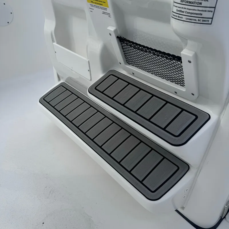 Slide: The Image of 2025 Tidewater 198 CC Adventure boat steps with non-slip surface and storage net. - 36