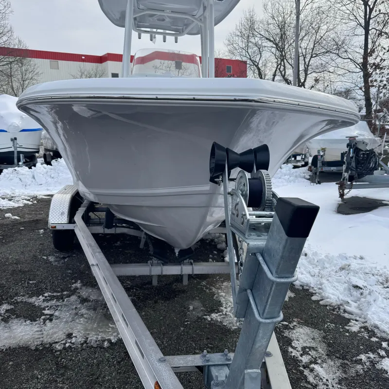 Slide: The Image of 2025 Tidewater 198 CC Adventure boat on trailer in snowy outdoor setting. - 4