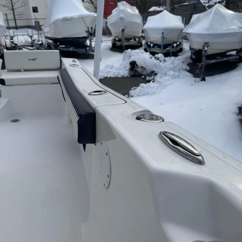 Slide: The Image of 2025 Tidewater 198 CC Adventure boat in snowy storage yard. - 43