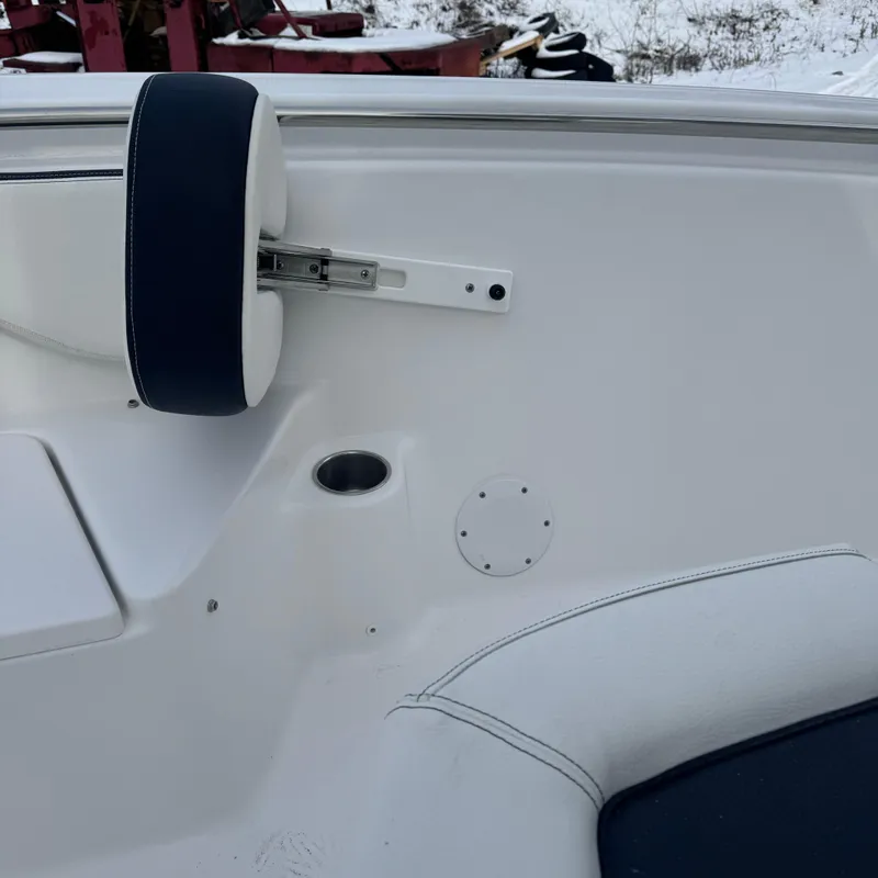 Slide: The Image of 2025 Tidewater 198 CC Adventure boat interior with white and navy seating detail. - 44