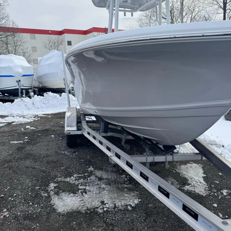 Slide: The Image of 2025 Tidewater 198 CC Adventure boat on trailer in snowy outdoor setting. - 8