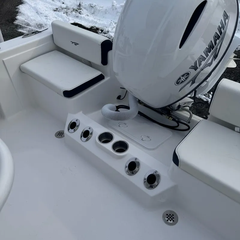 Slide: The Image of 2025 Tidewater 198 CC Adventure boat with Yamaha engine, featuring rod holders and seating. - 9